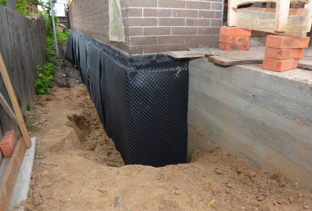 SJ Waterproofing Pros technician performing targeted Emergency Waterproofing assessment in Hartford, AL